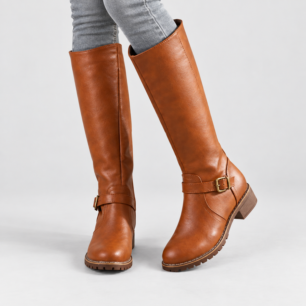 Knee-High Boots with Ankle Buckle in brown - front three-quarter view on model