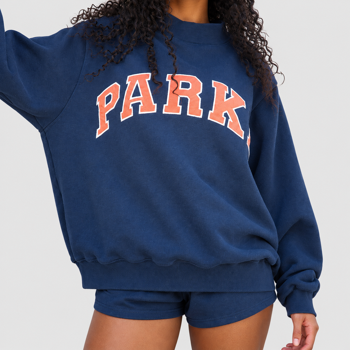 Marguerite | Women’s Oversized Mock-Neck Varsity Sweatshirt — Navy blue-orange words